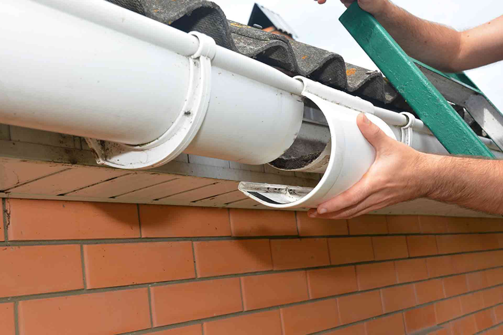 Gutter repair work being carried out on a residential property