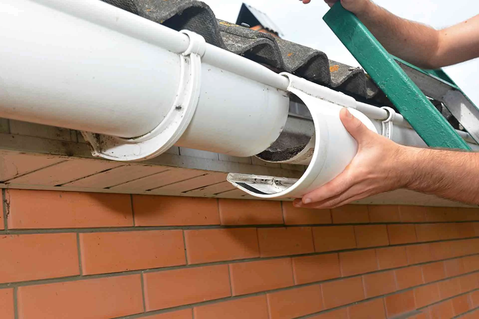 Gutter repair work being carried out on a residential property