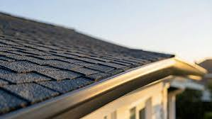 Close-up view of a residential roof edge and guttering during inspection